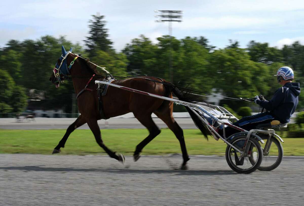 Standardbreds are taken out for morning work at the Saratoga Harness Racing at Saratoga Casino facility on Friday, Aug. 28, 2020, in Saratoga Springs, N.Y. The state said April 14, 2021 that fans (at 20 percent capacity) can go back to the track Friday, April 23, 2021. (Will Waldron/Times Union)