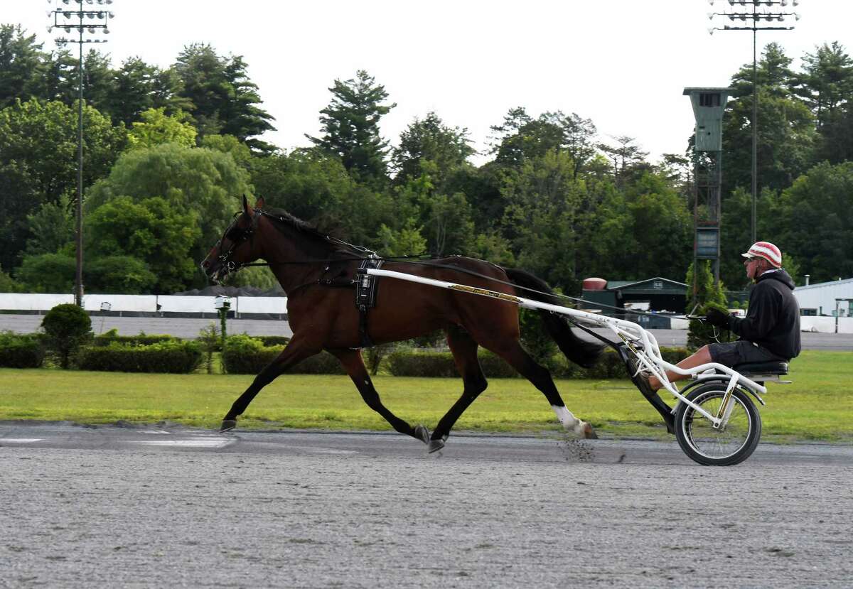 Standardbreds are taken out for morning work at the Saratoga Harness Racing at Saratoga Casino facility on Friday, Aug. 28, 2020, in Saratoga Springs, N.Y. (Will Waldron/Times Union)
