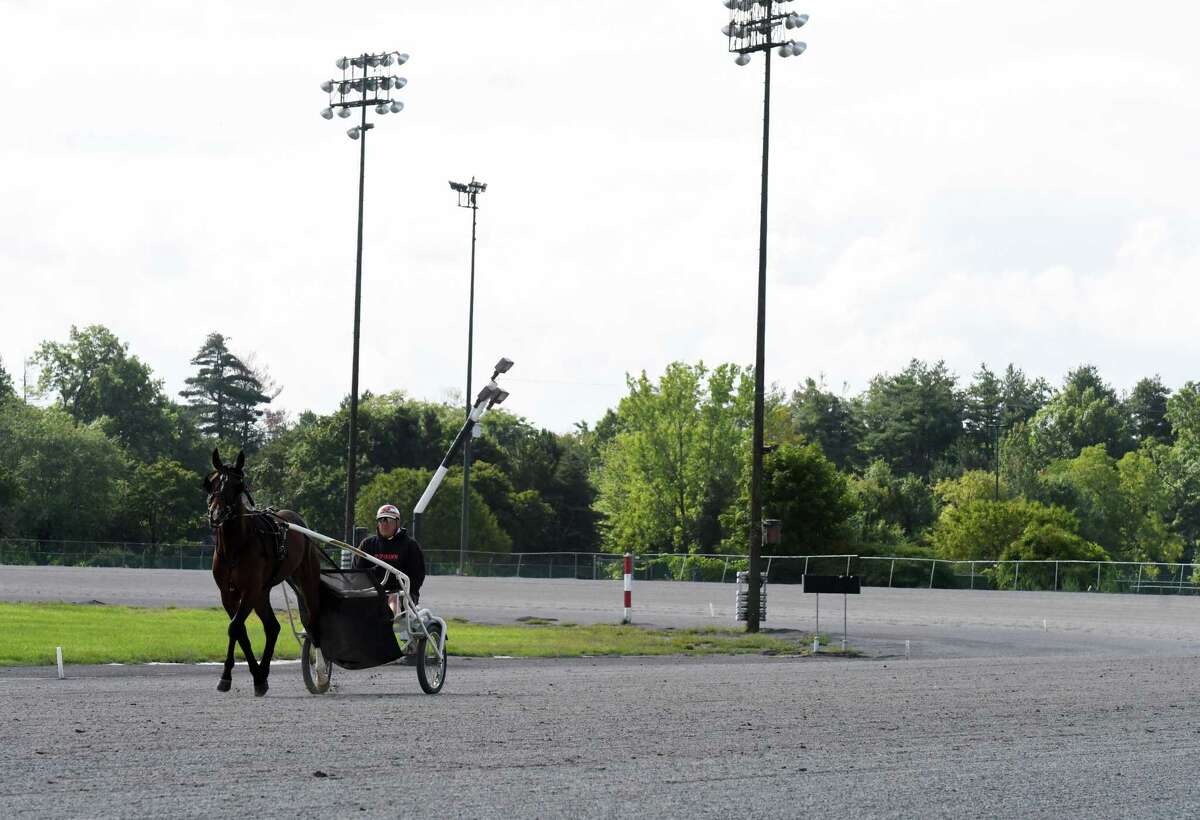 Standardbreds are taken out for morning work at the Saratoga Harness Racing at Saratoga Casino facility on Friday, Aug. 28, 2020, in Saratoga Springs, N.Y. (Will Waldron/Times Union)
