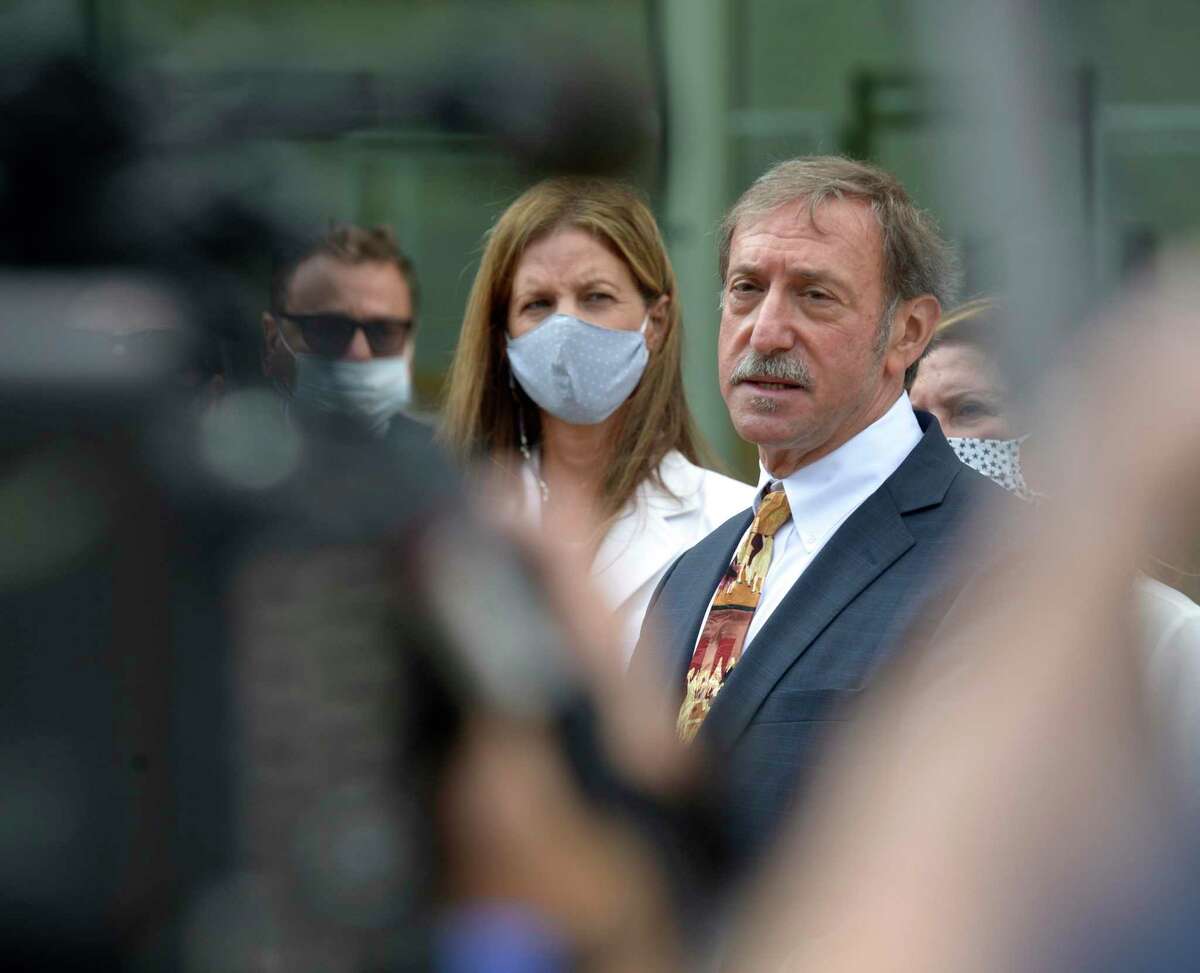 Attorney Jon Schoenhorn speaks to the media after representing Michelle Troconis, left, in Stamford Superior Court Stamford in connection to charges in the disappearance of Jennifer Dulos. Friday, August 28, 2020, in Stamford, Conn.