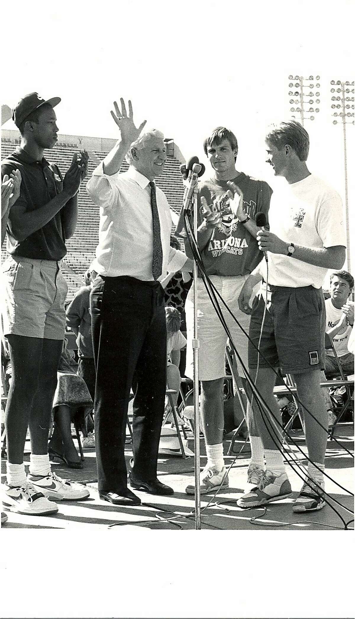 Steve Kerr and teammates stand with Lute Olson during�a rally and parade for the men's basketball team at University of Arizona stadium in Tucson, Ariz., after the 1988 NCAA Final Four.
