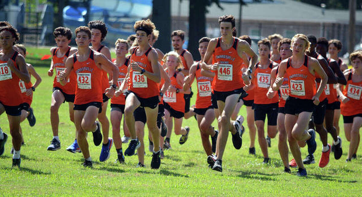 Edwardsville runners take off from the starting line during Friday’s season-opening dual meet against Granite City at Wilson Park.