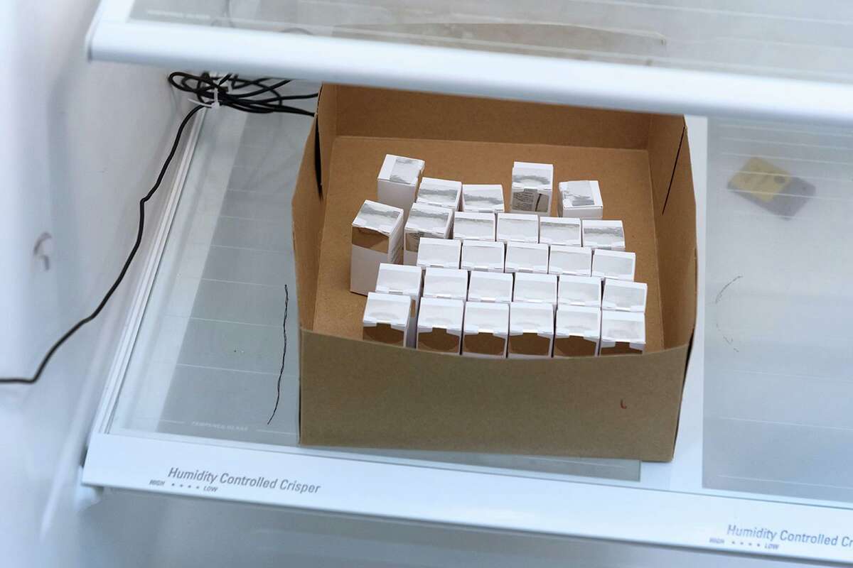 Boxes containing vials of Moderna's COVID-19 vaccine, known as mRNA-1273, are refrigerated at the Clinical Research Institute of Southern Oregon in Medford.