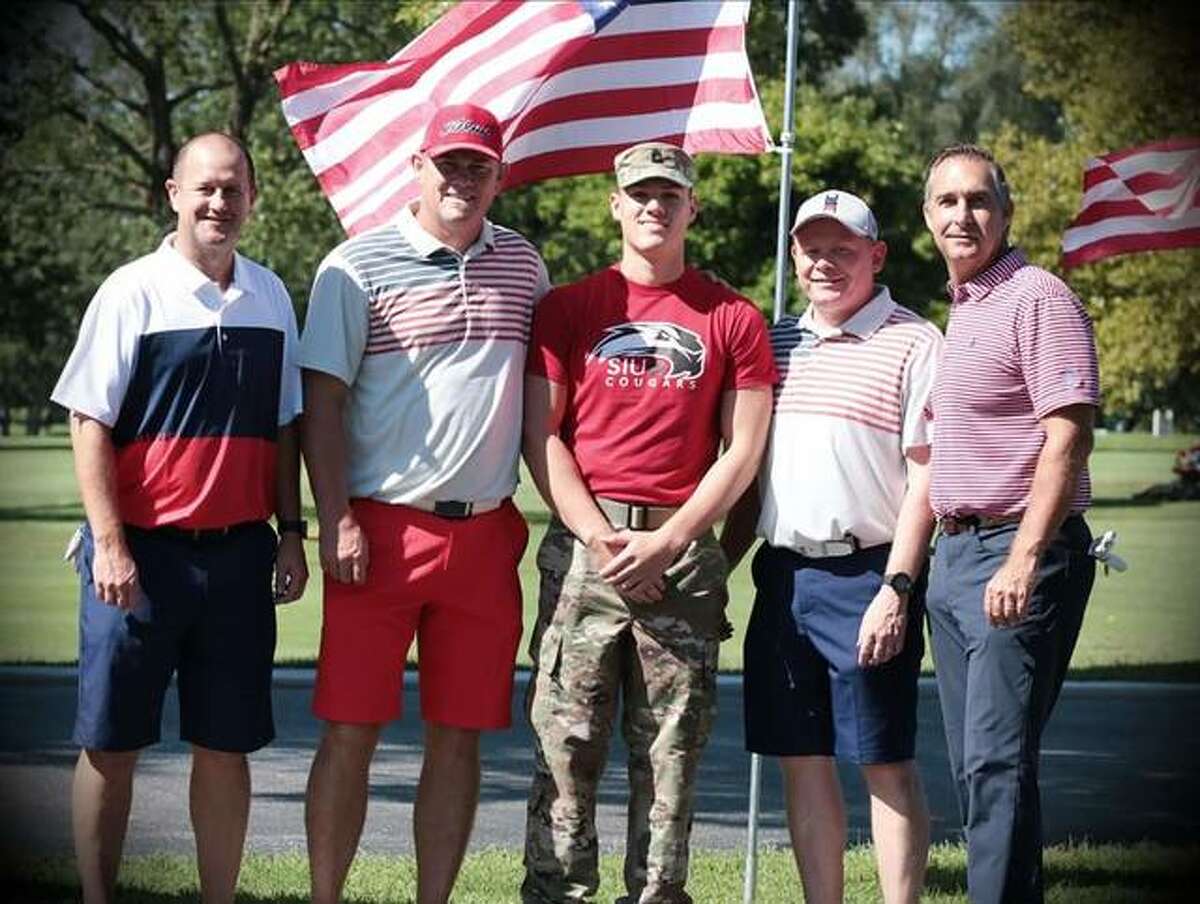 Golfers Jason Geminn, left; Jason Isringhausen, second from left; Cory Darr, second from right; John Mozeliak, right; pose with a member of the SIUE ROTC Color Guard during last year’s Volition America Five-Star Golf Challenge at Sunset Hills Country Club. Isringhausen is a former pitcher for the St. Louis Cardinals and Mozeliak is the Cardinals’ director of baseball operations.