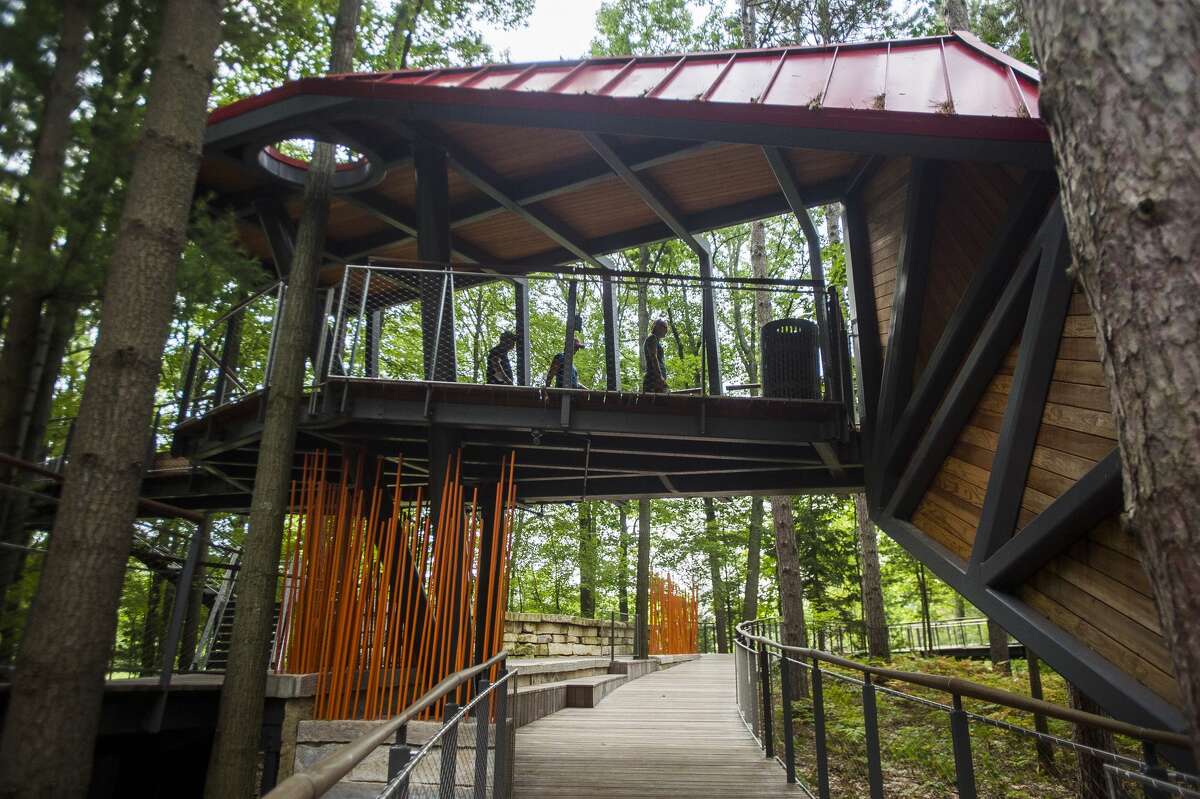 People visit the Whiting Forest Canopy Walk, which is open by appointment only, Thursday, Aug. 27, 2020 in Midland. (Katy Kildee/kkildee@mdn.net)