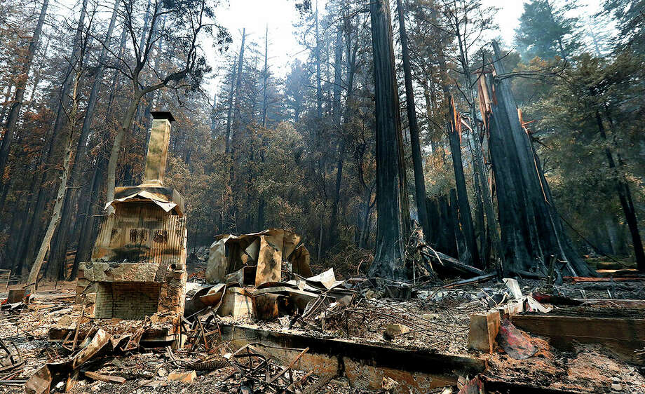 The fireplace of the Nature Lodge Museum and Store at Big Basin Redwoods State Park stands among the devastation Friday, Aug. 28, 2020, in Boulder Creek, Calif., wrought by the CZU August Lightning Complex, which destroyed nearly all buildings and burned thousands of trees at the park. Photo: Shmuel Thler/AP