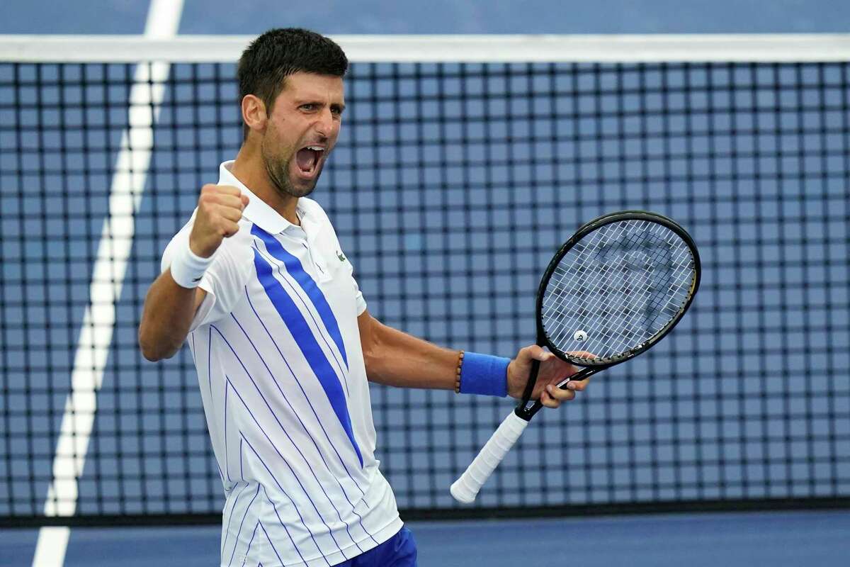 Novak Djokovic, of Serbia, reacts to winning his match with Milos Raonic, of Canada, during the finals of the Western & Southern Open tennis tournament Saturday, Aug. 29, 2020, in New York. (AP Photo/Frank Franklin II)