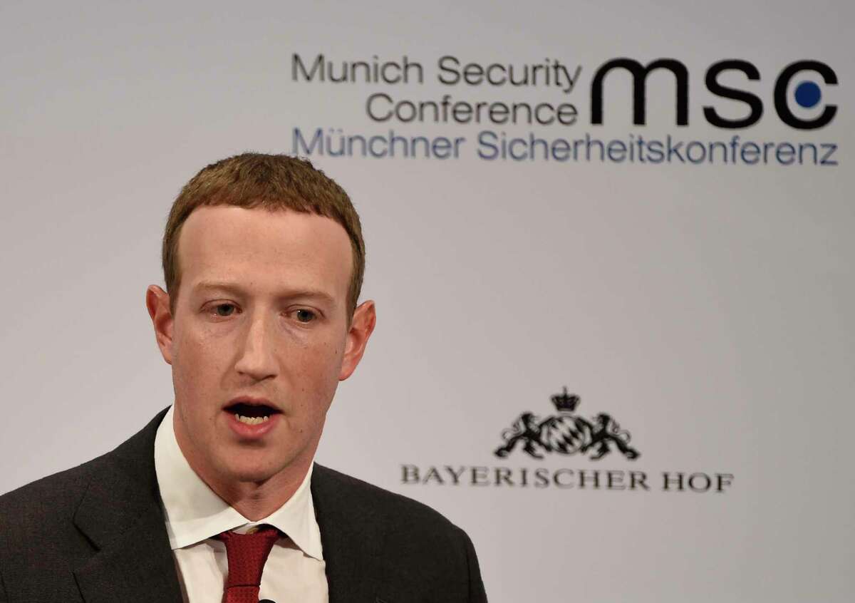 FILE - In this Feb. 15, 2020 file photo, Facebook CEO Mark Zuckerberg speaks on the second day of the Munich Security Conference in Munich, Germany. Zuckerberg, on Friday, Aug. 29, says Facebook made a mistake in not removing a militia groupas page earlier this week that called for armed civilians to enter Kenosha, Wis. amid violent protests following a police shooting of Jacob Blake, who is Black. (AP Photo/Jens Meyer, File)