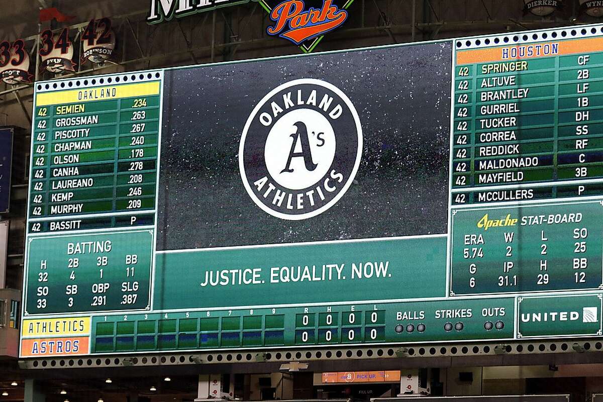 The scoreboard for baseball game is seen before both the Oakland Athletics and Houston Astros players walked off the field in protest of racial injustice before the start of their baseball game Friday, Aug. 28, 2020, in Houston. (AP Photo/Michael Wyke)