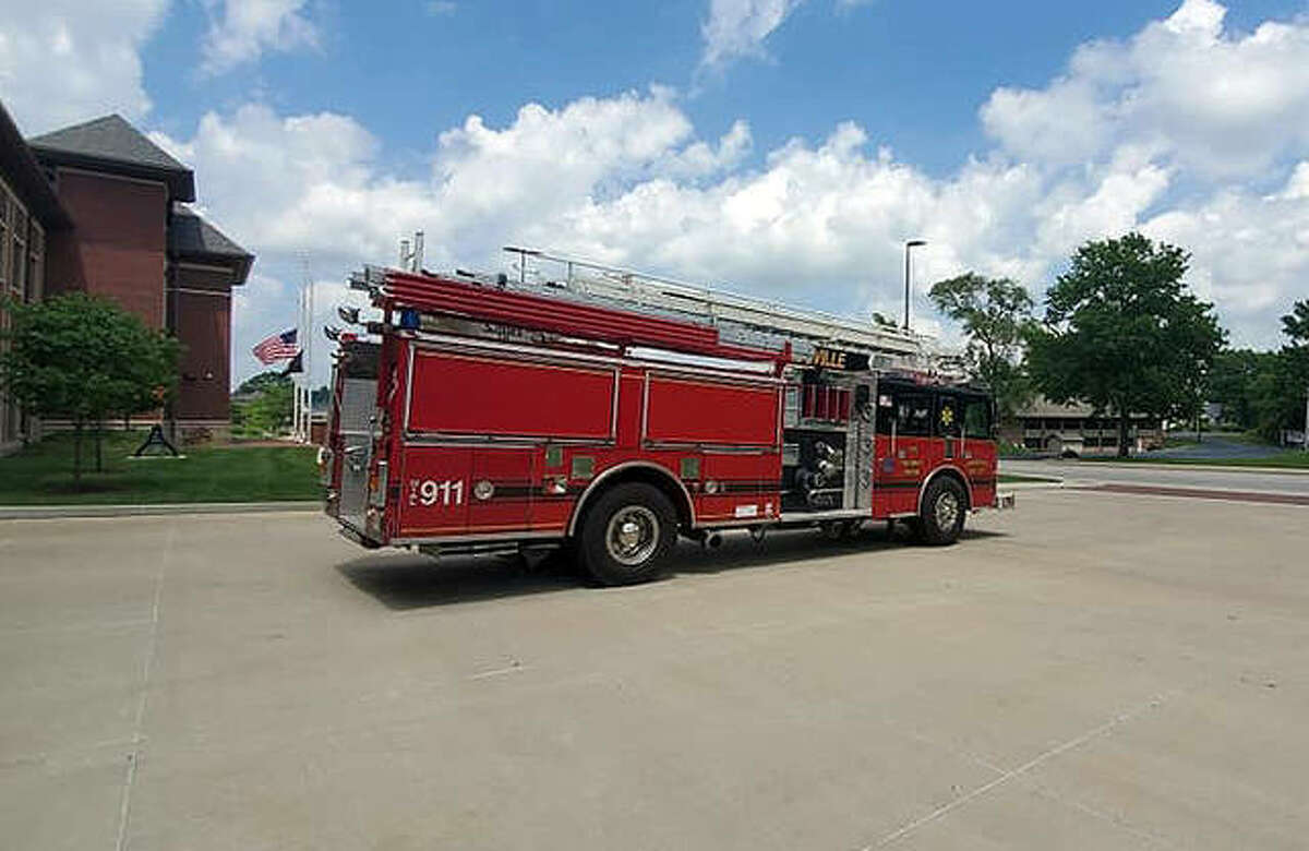 FILE - Engine 1318 bids good-bye to Fire Station 1 on S. Main Street before it heads to Witt, Illinois to begin its new service life for the volunteer fire department there.