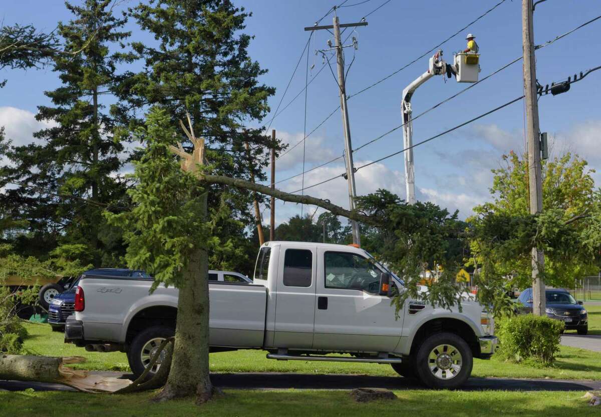 Line crews repair electrical lines near the intersection of Routes 40 and 67 on Sunday, Aug. 30, 2020, in Schaghticoke, N.Y. (Paul Buckowski/Times Union)