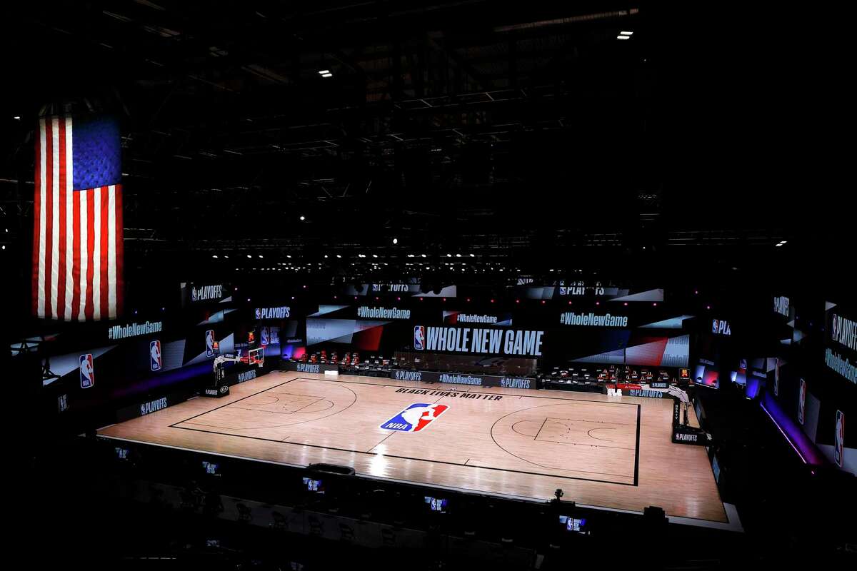 An empty court and bench is shown following the scheduled start time for a game between the Milwaukee Bucks and Orlando Magic on Aug. 26. The teams boycotted the game to protest the shooting of Jacob Blake in Kenosha, Wisconsin.