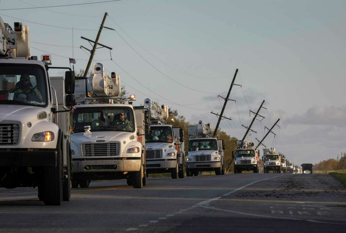 Utility crews pass a national guard humvee while driving north on State Highway 27 on Saturday, Aug. 29, 2020, in Cameron Parish near Grand Lake, La. Hurricane Laura made landfall near Cameron early Thursday morning.
