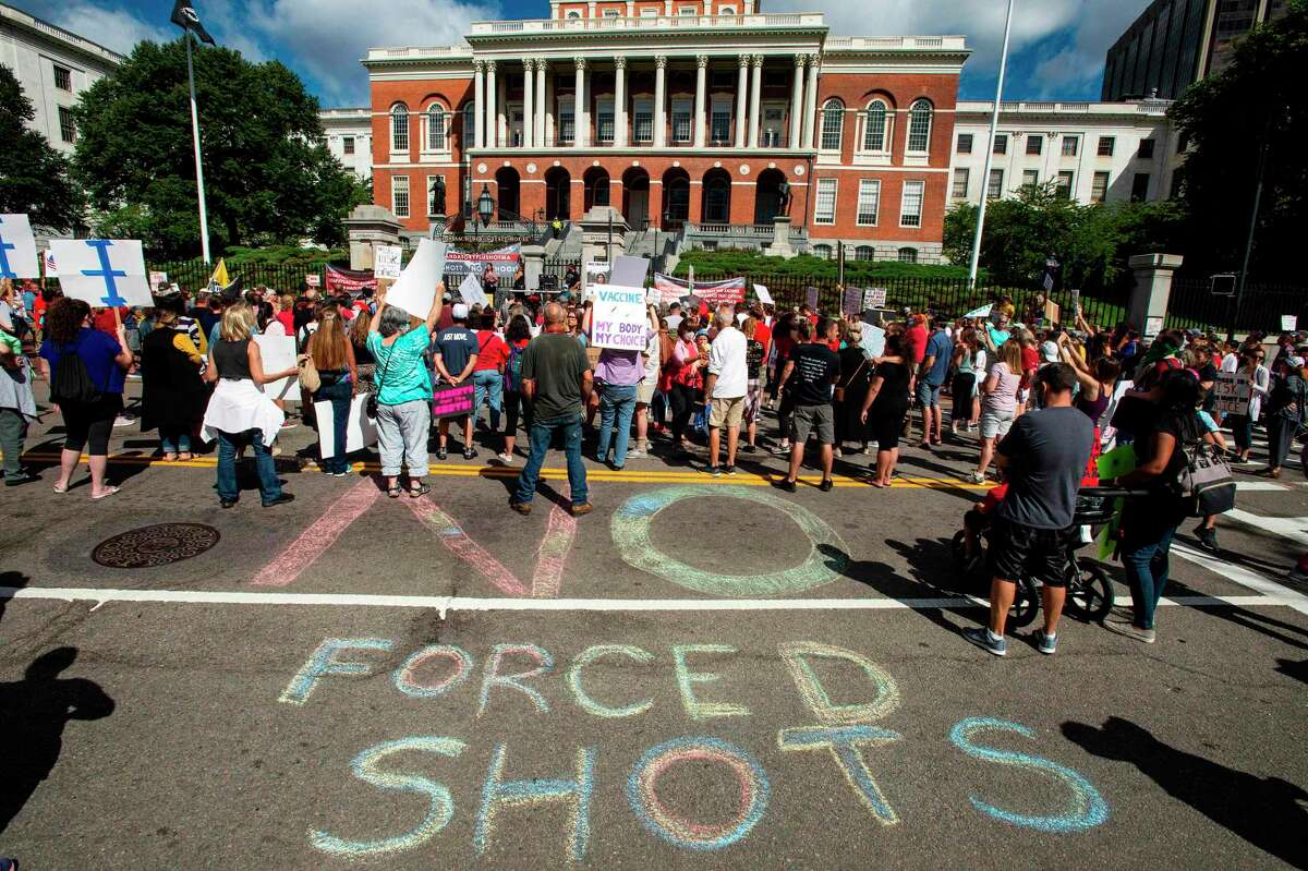 People draw a "No Forced Shots" message on the street in chalk during a protest with people of mixed political views, religions and cultures after a mandate from the Massachusetts Governor requiring all children,age K-12, to receive an influenza (flu) vaccine/shot to attend school for the 2020/2021 year, outside the Massachusetts State House in Boston on August 30, 2020. Despite all those concerns — on the independence of the process, the motivations and accuracy of the president — 67 percent of people surveyed said they would get a vaccine as soon as one is available. So, assuming those fears aren’t justified and the process isn’t totally corrupted by politics, we might actually reach some level of herd immunity if a vaccine is ever shown to be effective, approved, released and administered to the general public before (the way this year is going) a meteor crashes into the Earth or the planet gets sucked into a black hole or something.