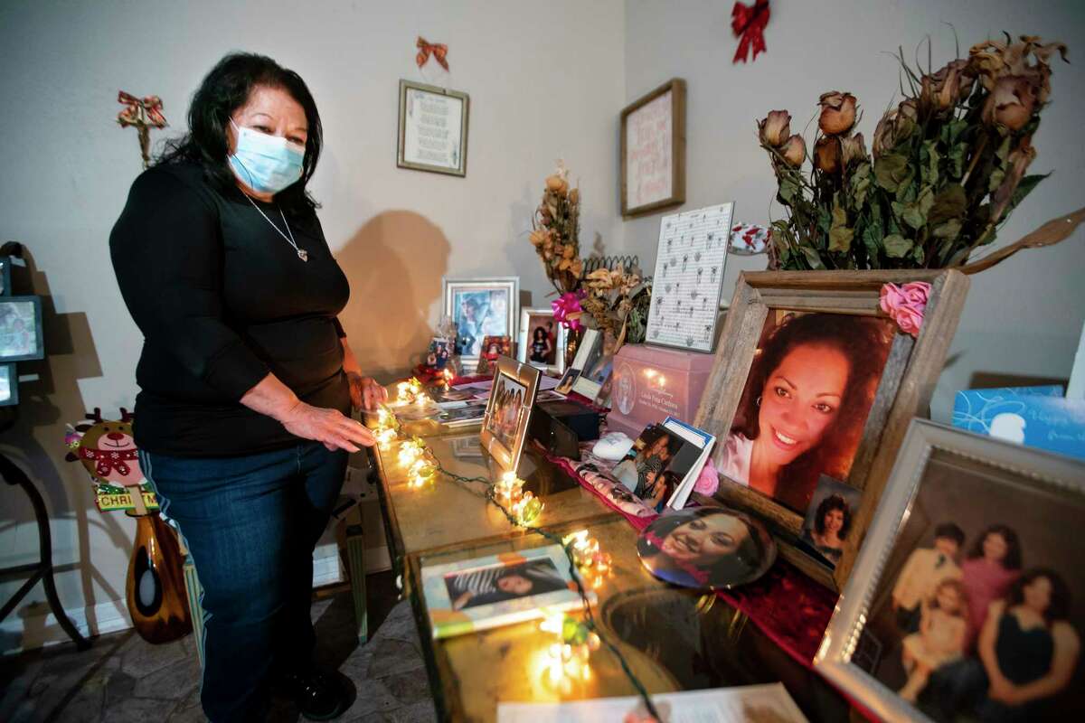 Rosie Peña maintains a tribute to her daughter, Linda Pena Cordona, who was murdered in 2017, Sunday, Aug. 2, 2020, inside her Houston home. The family has now been waiting years for the accused killer to go to trial. Court documents show that Ricardo Olivarez pleaded guilty in early October and was taken back into custody, but the judge has reinstated his bond, and Olivarez is still out of custody waiting for trial. Harris County currently has a backlog of more than 1300 people awaiting trial on murder or capital murder charges.