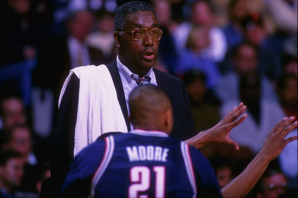 Georgetown coach John Thompson watches a 1996 win over UConn. Thompson died on Monday at 78.