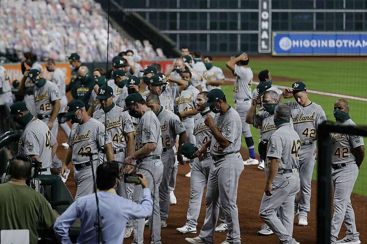 HOUSTON, TEXAS - AUGUST 28: The Oakland Athletics walk off the field before playing the Houston Astros as both teams elected not to play in protest of racial injustice and the shooting of Jacob Blake by Kenosha, Wisconsin police at Minute Maid Park on August 28, 2020 in Houston, Texas. All players are wearing #42 in honor of Jackie Robinson Day. The day honoring Jackie Robinson, traditionally held on April 15, was rescheduled due to the COVID-19 pandemic. (Photo by Bob Levey/Getty Images)