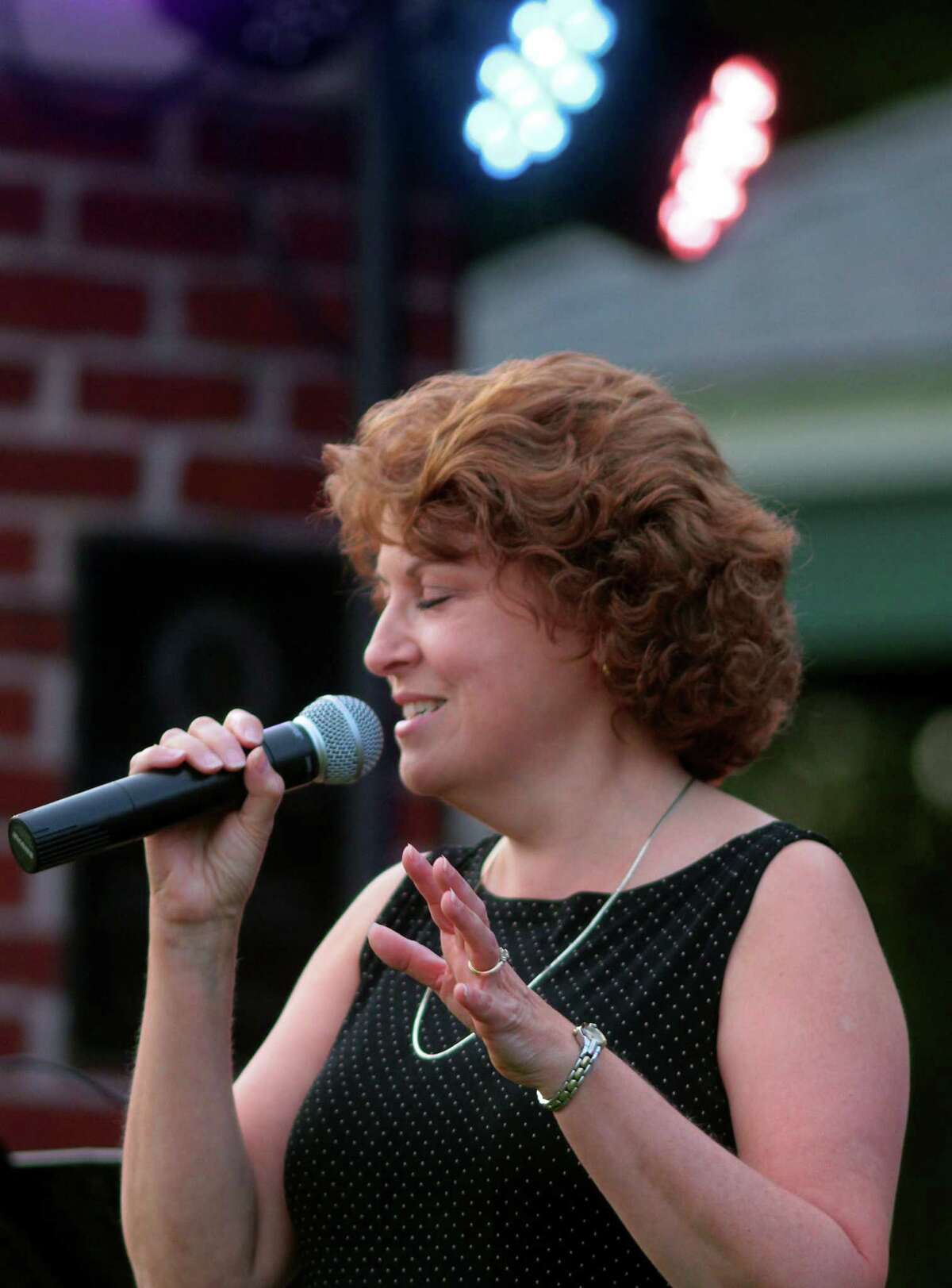 The Little Big Band's Joyce Medling performs during Shelton's Summer Concert series at Riverview Park in Shelton, Conn., on Wednesday Aug.26, 2020.