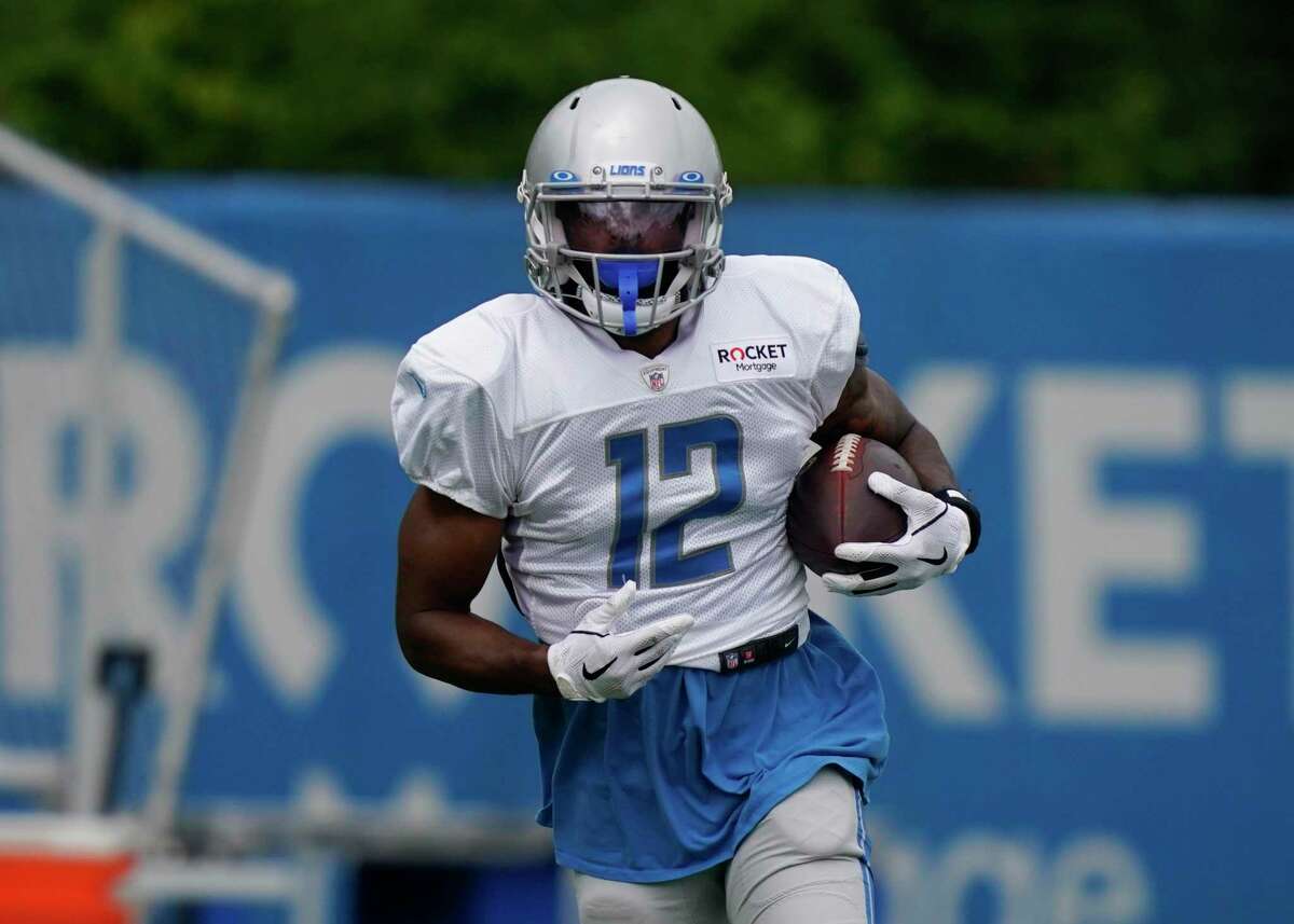 Detroit Lions wide receiver Geremy Davis runs a drill during an NFL football camp practice on Saturday. The Lions announced that they cut the former UConn star.