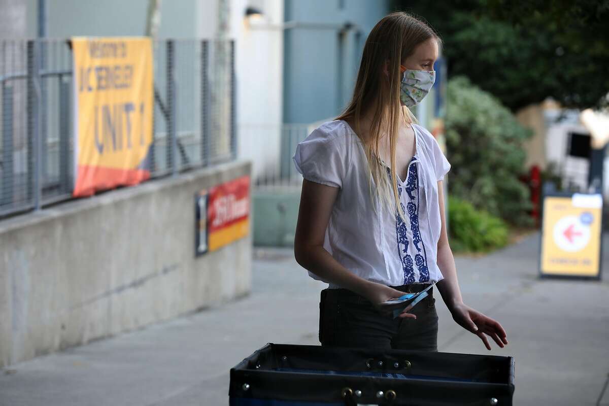 Student Cameron Johnson, 19 years old, begins to move to her dorm room on Thursday, Aug. 20, 2020, in Berkeley, Calif. Some of the 2,200 students who will be on the UC Berkeley campus began moving into Units 1 and Units 2.