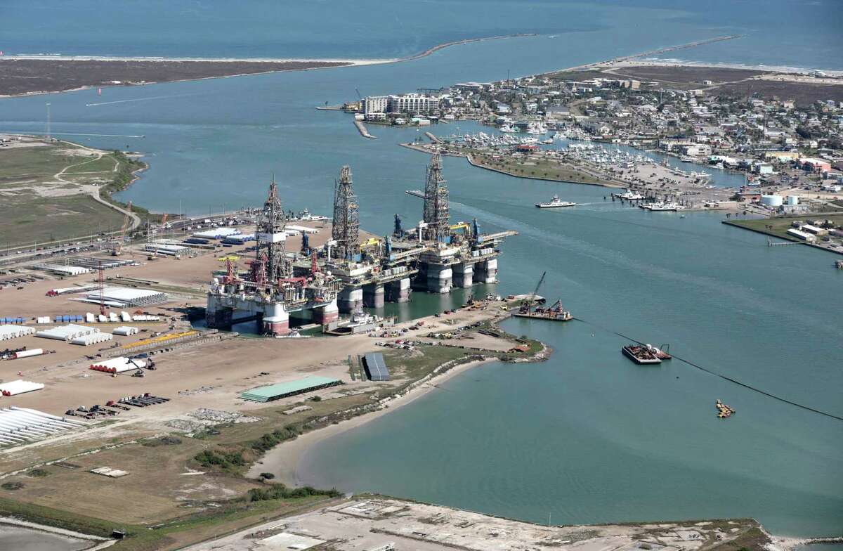 Industrial operations on Harbor Island with the popular town of Port Aransas to the right. A proposal to build a terminal for giant crude haulers right across from the Port Aransas Marina and city park is drawing pushback from locals. Tuesday, Feb. 25, 2020.