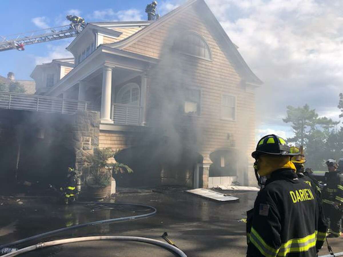 Emergency responders tackle fire on Contentment Island in Darien