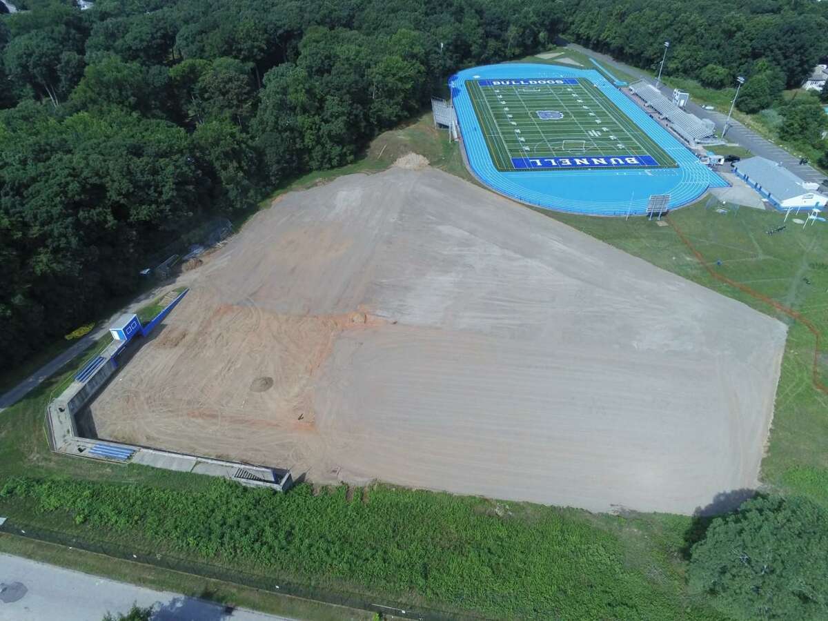 An aerial view of the athletic complex at Bunnell High School in Stratford. The baseball field, which will include a new multi-purpose field in the outfield, is in the foreground under construction, with Robert Mastroni Field in the background.