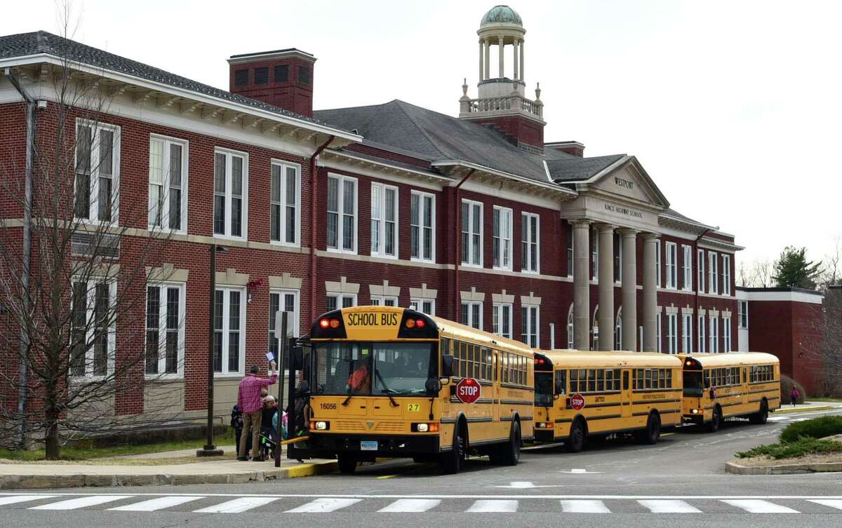 Students leave Kings Highway Elementary School on the announcement that Westport Schools will be closed for the unforeseen future Wednesday, March 11, 2020, in response to the Covid-19 virus pandemic in Westport, Conn.