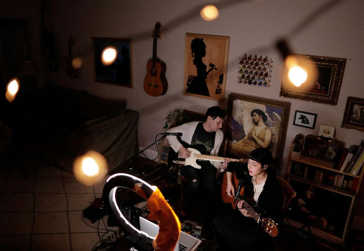 Laura Weinbach and Anton Patzner, known as Foxtails Brigade, hold a streaming show on Mondays at 7:30 in their home in Oakland, Calif., on Monday, April 6, 2020. The couple has been holding these shows for years.