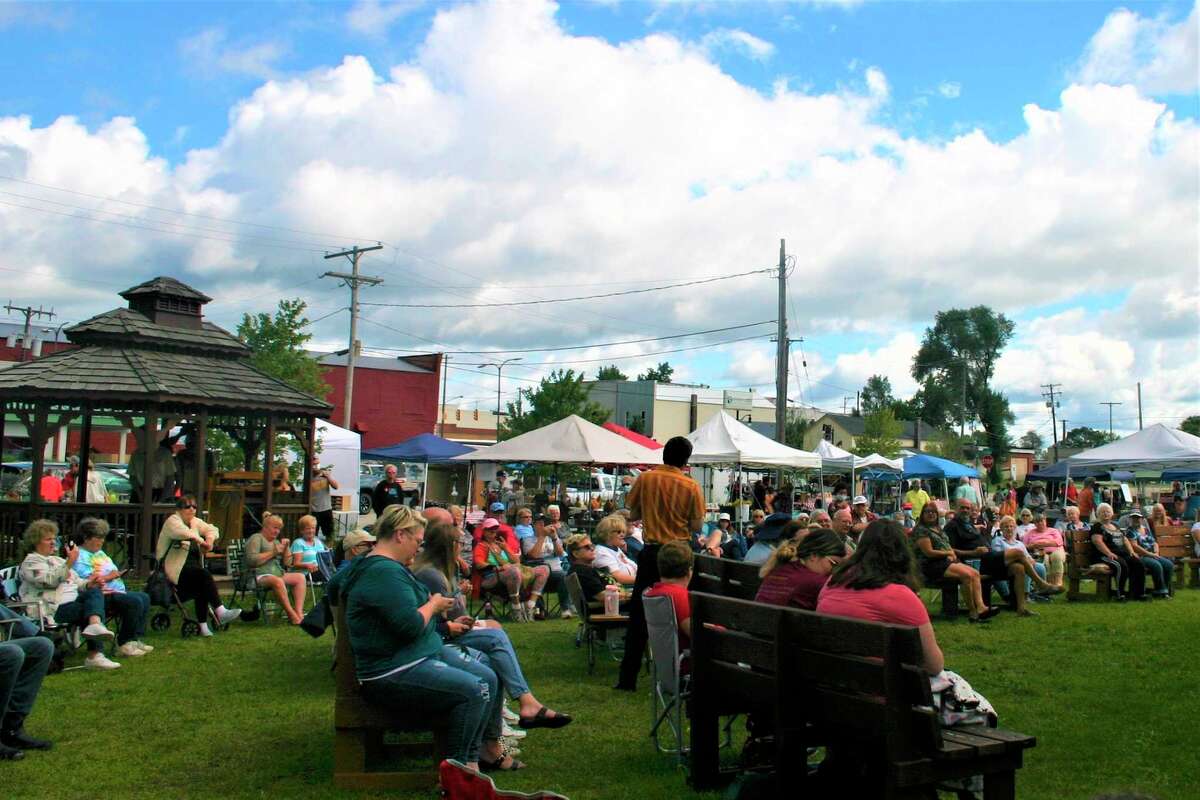 Jake Slater entertains a crowd at Evart Farmers' Market