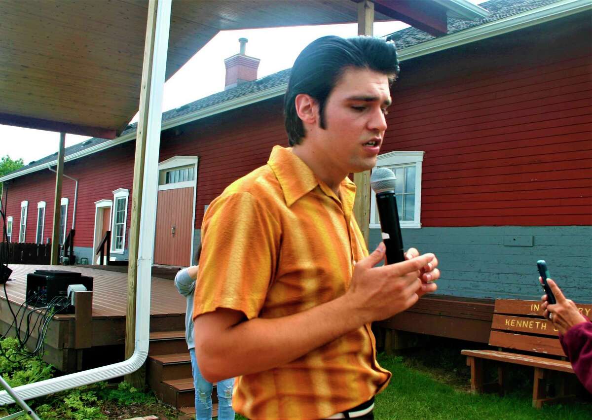 Jake Slater entertains a crowd at Evart Farmers' Market