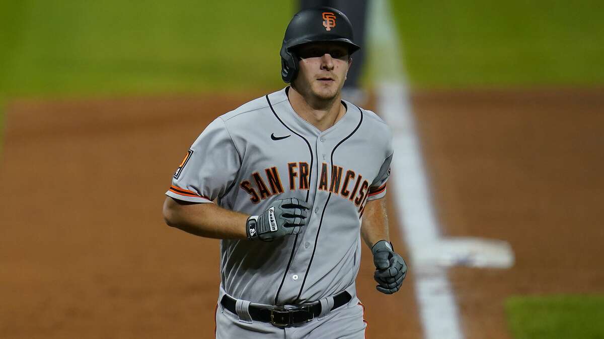 San Francisco Giants left fielder Alex Dickerson (12) in the sixth inning of a baseball game Tuesday, Sept. 1, 2020, in Denver. (AP Photo/David Zalubowski)