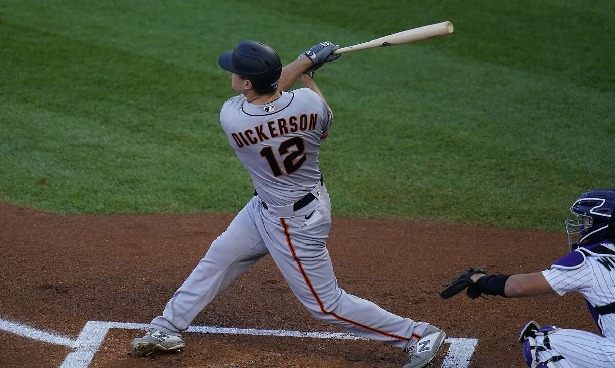 San Francisco Giants left fielder Alex Dickerson (12) in the first inning of a baseball game Tuesday, Sept. 1, 2020, in Denver. (AP Photo/David Zalubowski)