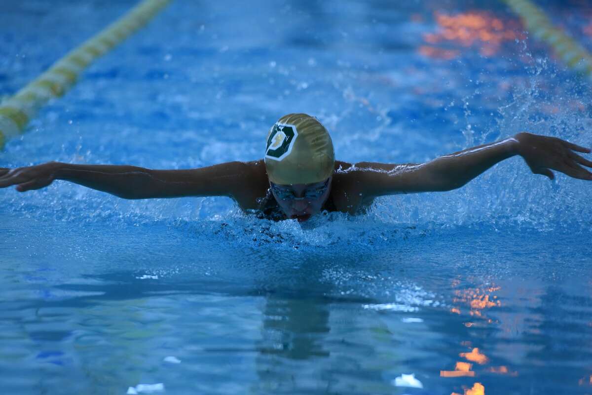 Dow High's Ella Roberson competes in the 100-yard butterfly during the 2019 season.