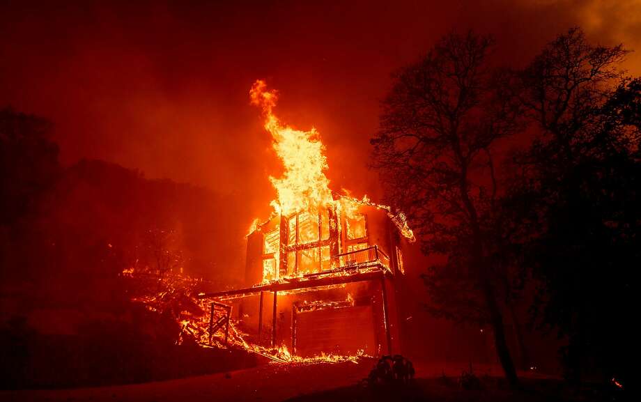 TOPSHOT - A home burns in the Spanish Flat area of Napa, California as flames rage through on August 18, 2020. - The Hennessey Fire started in the early hours of August 17 in the Napa wine region of Northern California. The fire grew to 2,700 acres in 24 hours and is 0% contained. Dozens of fires are burning out of control throughout Northern California as fire resources are spread thin. (Photo by JOSH EDELSON / AFP) (Photo by JOSH EDELSON/AFP via Getty Images) Photo: Josh Edelson / AFP Via Getty Images