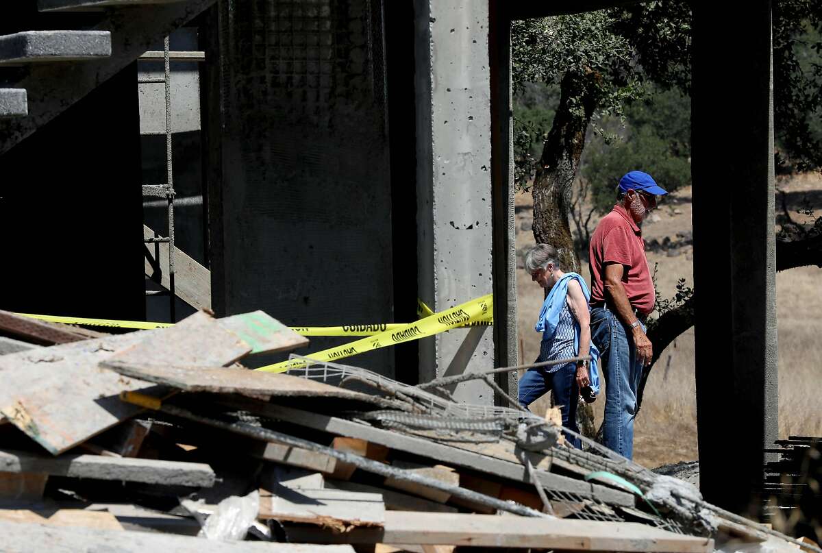 Frank Tansey and his wife Nancy Watson-Tansey look at their home at 2877 Rollo Rd. on Thursday, August 27, 2020, in Santa Rosa, Calif. Their original home was destroyed in a wildfire. Sara Harrison Woodfield is the architect of the home under construction.