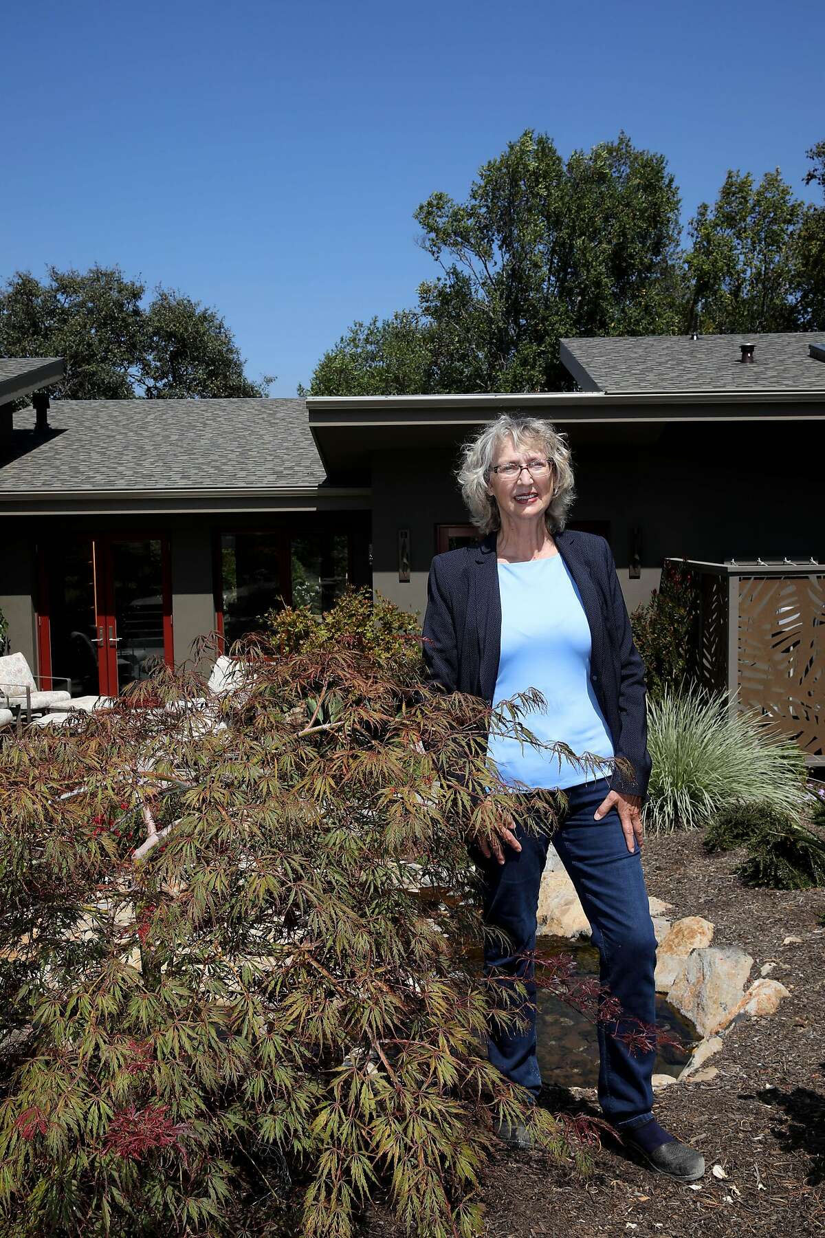 Architect Sara Harrison Woodfield poses for a portrait in the backyard belonging to Sandy and Dave Sandine on Thursday, August 27, 2020, in Santa Rosa, Calif.