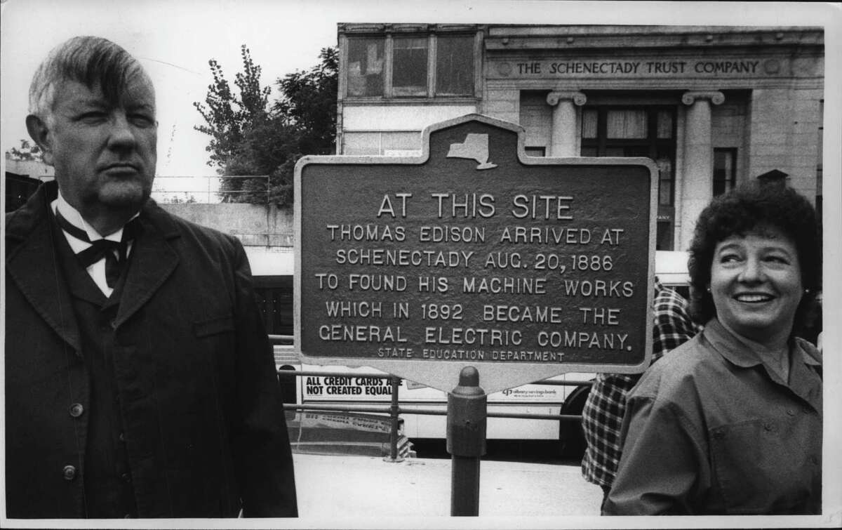 Schenectady Mayor Karen Johnson, right is all smiles as Wayne Harvey, left, former Past President of the historical society portrays Thomas Edison at the unveiling of a Thomas Edison historical plaque. They were photographed in the Amtrak parking lot on State Street. Sept. 3, 1986 (Paul D. Kniskern Sr./Times Union Archive)