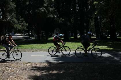 Cyclists ride on the bike lane at the Panhandle at Fell and Baker in San Francisco, Calif., on Saturday, July 25, 2020.