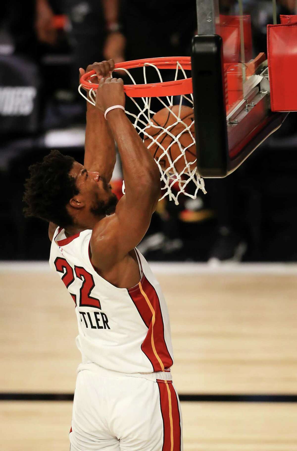 LAKE BUENA VISTA, FLORIDA - SEPTEMBER 02: Jimmy Butler #22 of the Miami Heat dunks the ball during the first quarter against the Milwaukee Bucks in Game Two of the Eastern Conference Second Round during the 2020 NBA Playoffs at the Field House at ESPN Wide World Of Sports Complex on September 02, 2020 in Lake Buena Vista, Florida. NOTE TO USER: User expressly acknowledges and agrees that, by downloading and or using this photograph, User is consenting to the terms and conditions of the Getty Images License Agreement. (Photo by Mike Ehrmann/Getty Images)