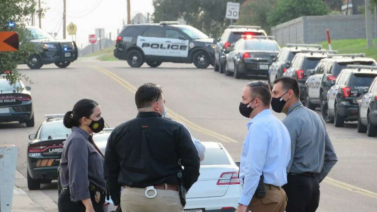 Laredo police investigators are seen in the area where a standoff was reported. Authorities said that Shiloh Drive was shutdown between Shama Circle and McPherson Road for an “ongoing situation.” The bomb squad, SWAT team, command center and Laredo Fire Department rescue units also responded to the area.