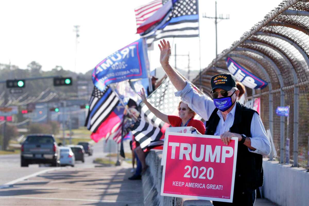 Louis Ray of Houston, front right, made the trip to demonstrate his Trump support during a "Silent Majority Stands with Trump" rally for the president and law enforcement on the 336 overpass of I-45 at Exit 88 Saturday, Aug. 29, 2020 in Conroe, Texas.