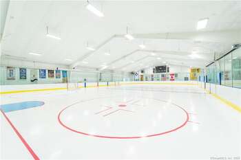 The house at 503 Studio Road Stamford, CT comes with a professional ice rink. It's on the markert for $7,690,000.