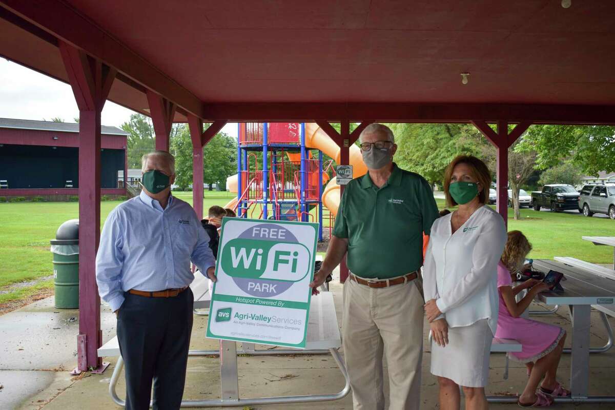 Pigeon Mayor Michael LePage joined Ed Eichler, president and CEO of Agri-Valley Communications, and Barb Main, manager of Agri-Valley Services, to launch a new free Wi-Fi service in Pigeon's Recreation Park. (Paige Withey/Huron Daily Tribune)