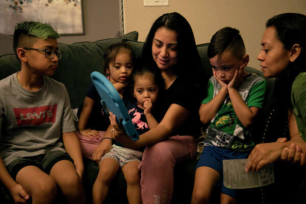 Vanessa, with her twins, Olivia and Sophia, and her son, Aiden, are joined by her sister, Alex, right, and Alex's son, Fabian Vasquez, 8, left, on a video call with Nora.