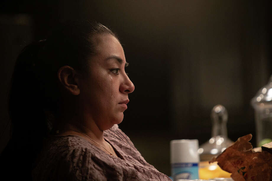 Vanessa grieves the loss of her mother, Nora. Vanessa and her brother Andy were able to see their mother in person the evening before she died. Photo: Lisa Krantz, Staff Photographer / San Antonio Express-News