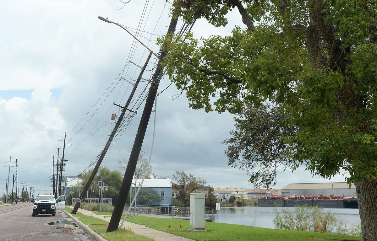 Power poles lean on Front Street in Orange, a week after the area was hit with some of the most severe damage in Southeast Texas by Hurricane Laura. Photo taken Thursday, September 3, 2020 Kim Brent/The Enterprise
