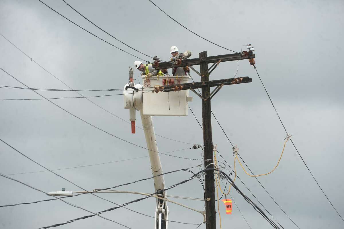 Electric workers make repairs to a powerline in Orange a week after the area was hit with some of the most severe damage in Southeast Texas by Hurricane Laura. Photo taken Thursday, September 3, 2020 Kim Brent/The Enterprise