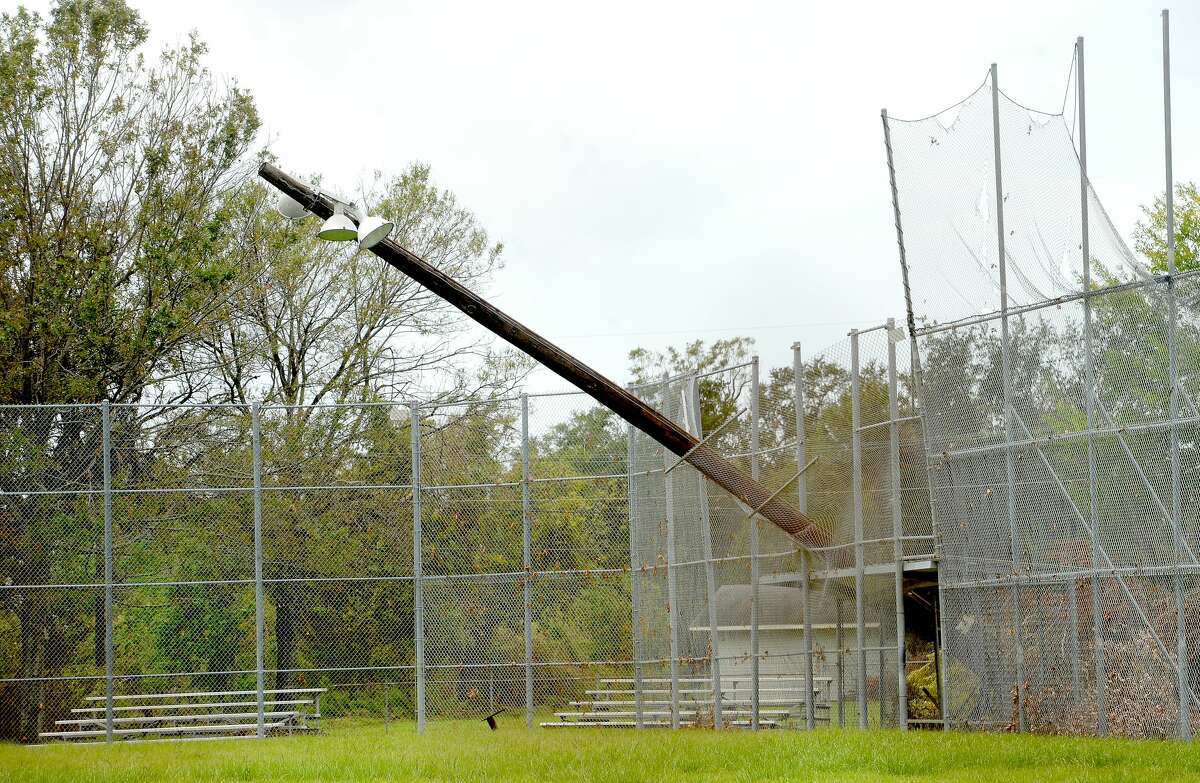A field light rests against the fencing around Simmonns Field in Orange a week after the area was hit with some of the most severe damage in Southeast Texas by Hurricane Laura. Photo taken Thursday, September 3, 2020 Kim Brent/The Enterprise