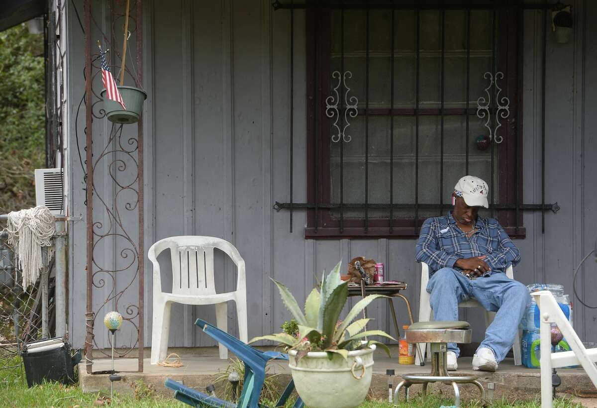 A man sleeps on his front porch amid ongoing power outages in Orange a week after the area was hit with some of the most severe damage in Southeast Texas by Hurricane Laura. Photo taken Thursday, September 3, 2020 Kim Brent/The Enterprise